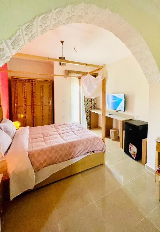 Postel nebo postele na pokoji v ubytování Jewel Howard Carter Hotel