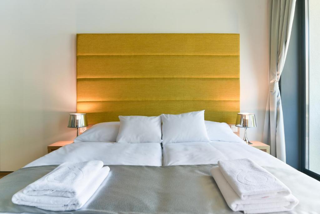 Postel nebo postele na pokoji v ubytování R31 Residence