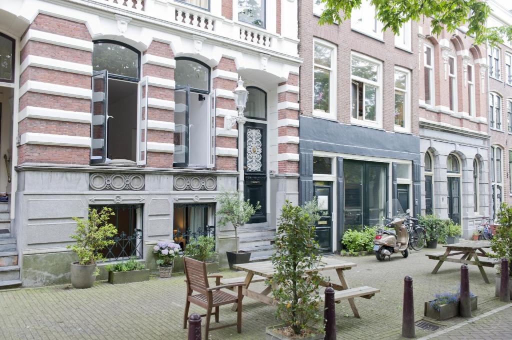 
a city street with a brick building at Luxurious Canal Apartment in Amsterdam
