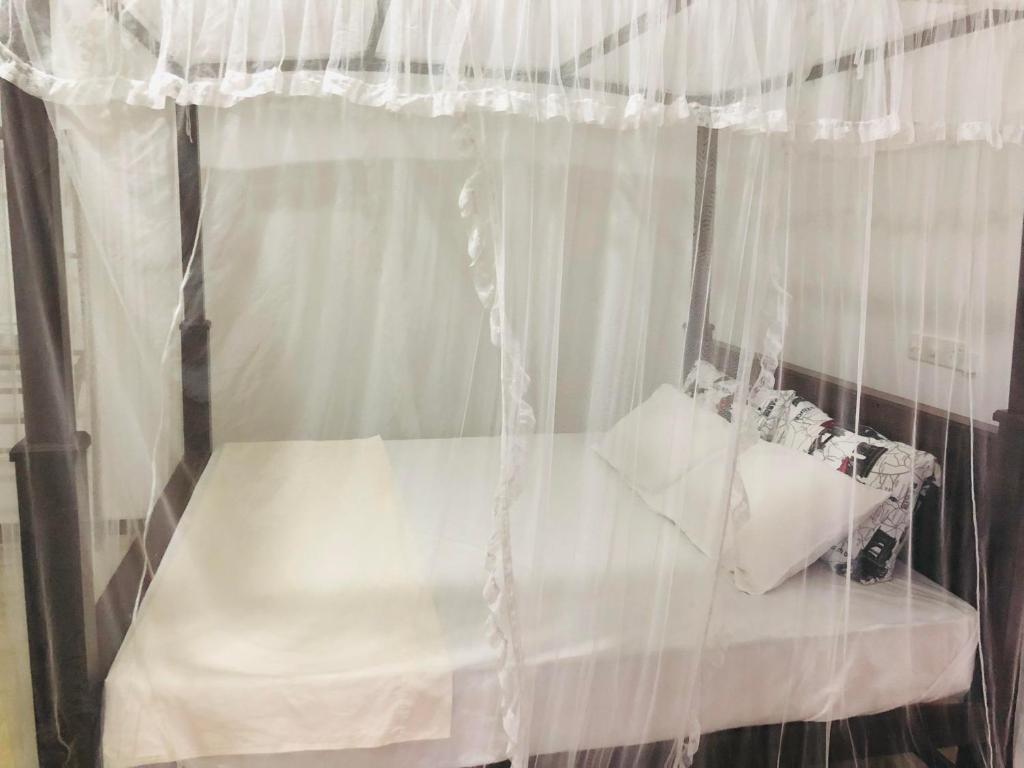 Postel nebo postele na pokoji v ubytování Amor Place Unawatuna