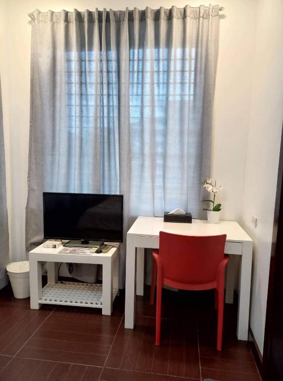 TV a/nebo společenská místnost v ubytování GLC SUITES