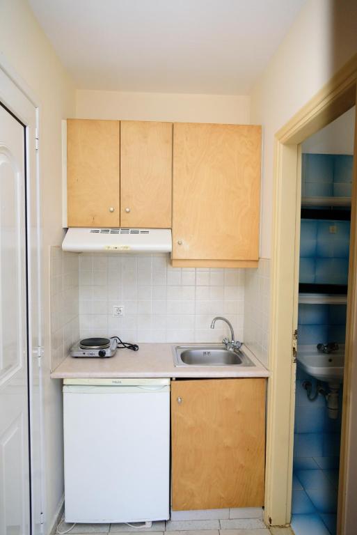 Kuchyň nebo kuchyňský kout v ubytování Sunset Apartments