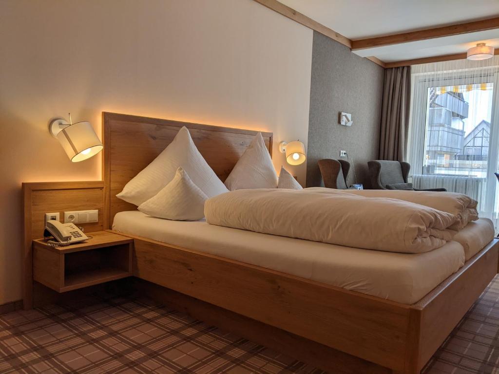 Postel nebo postele na pokoji v ubytování Hotel Germania