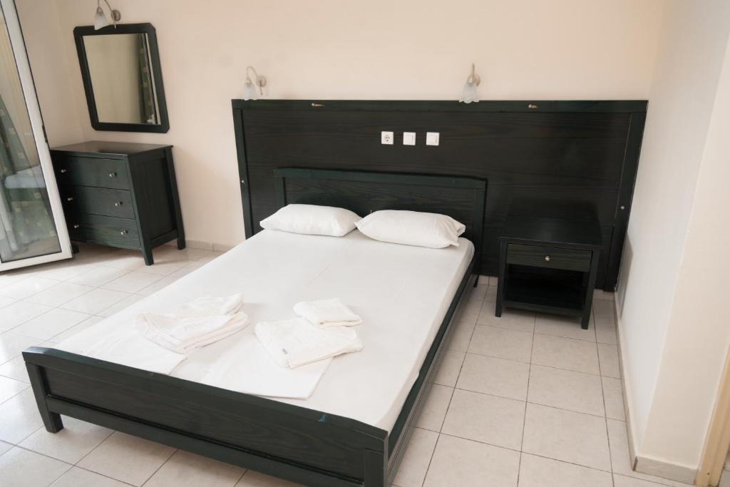Postel nebo postele na pokoji v ubytování Sunset Apartments
