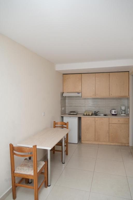 Kuchyň nebo kuchyňský kout v ubytování Sunset Apartments