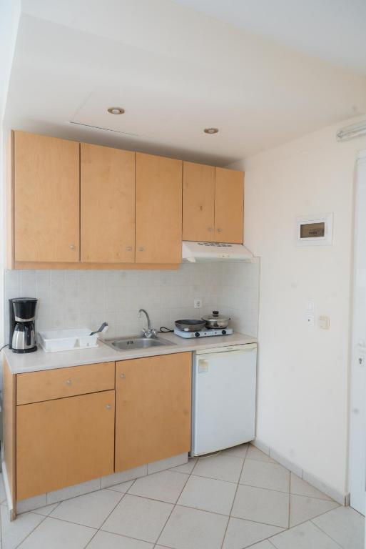 Kuchyň nebo kuchyňský kout v ubytování Sunset Apartments