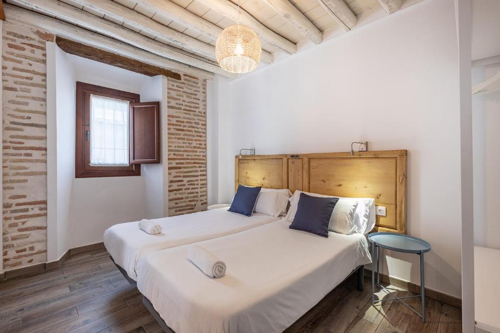 Postel nebo postele na pokoji v ubytování Apartamentos Boutique Granada Albaicín 3000