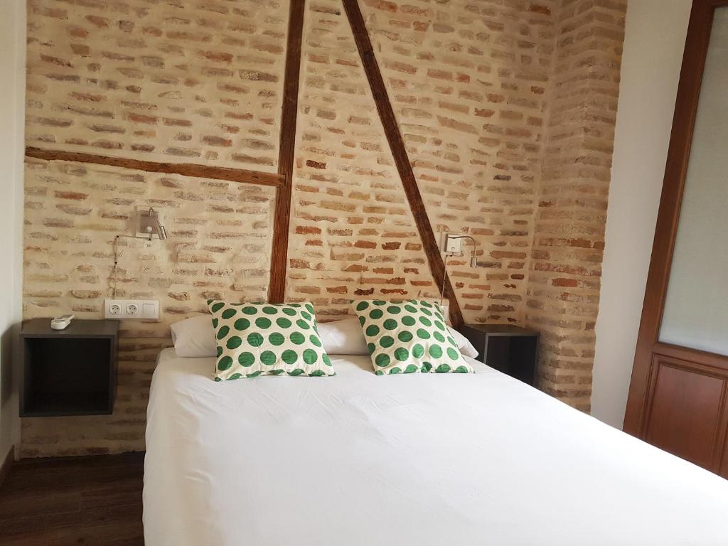 Postel nebo postele na pokoji v ubytování Apartamentos Boutique Granada Albaicín 3000