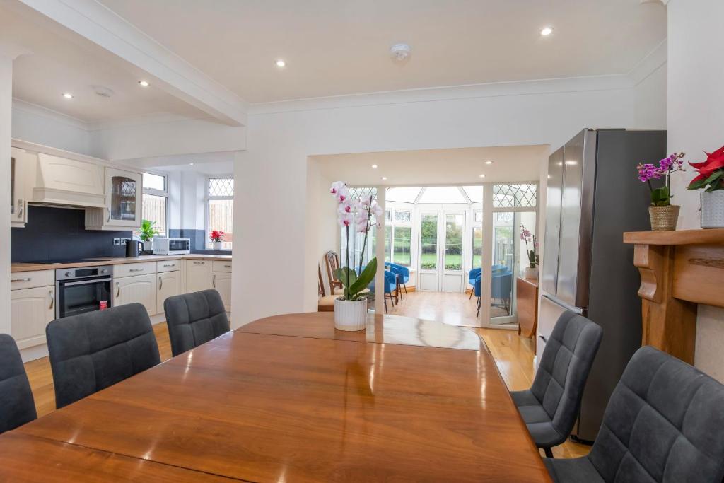 a kitchen and dining room with a wooden table and chairs at Peace house - 56 Sycamore Terrace in York