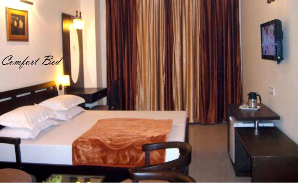 Postel nebo postele na pokoji v ubytování Hotel Hong Kong Inn