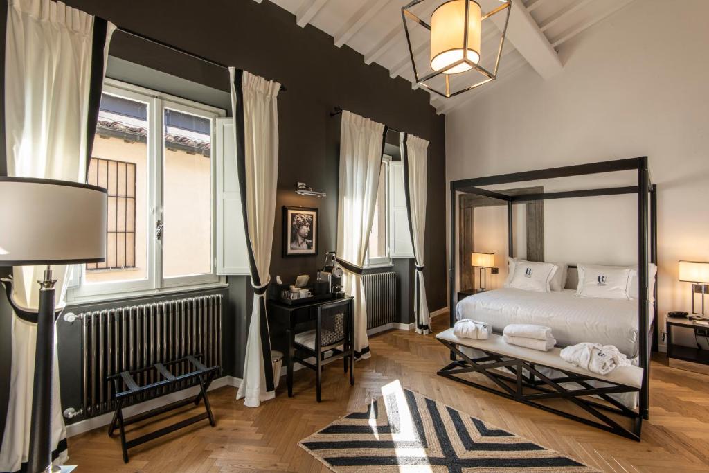 Postel nebo postele na pokoji v ubytování Relais Uffizi