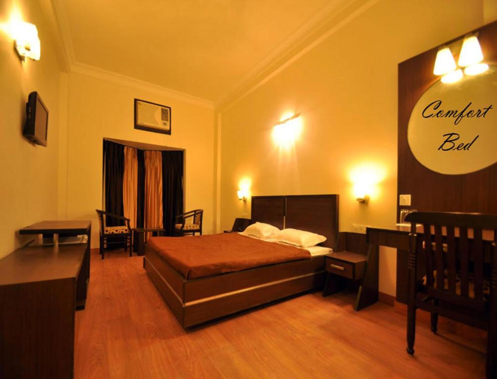 Postel nebo postele na pokoji v ubytování Hotel Hong Kong Inn