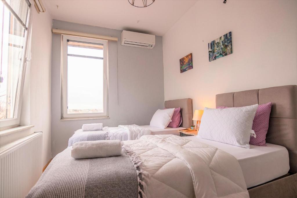A bed or beds in a room at Taksim Roya Apartment -center of the Istanbul