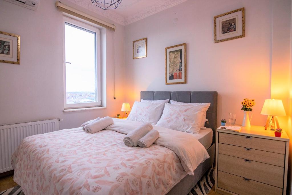 A bed or beds in a room at Taksim Roya Apartment -center of the Istanbul