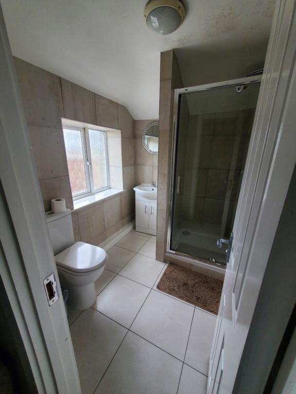 Koupelna v ubytování KGT House