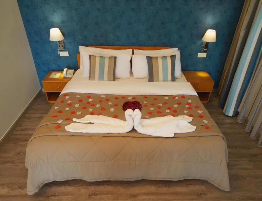 Postel nebo postele na pokoji v ubytování Casa D'or Hotel