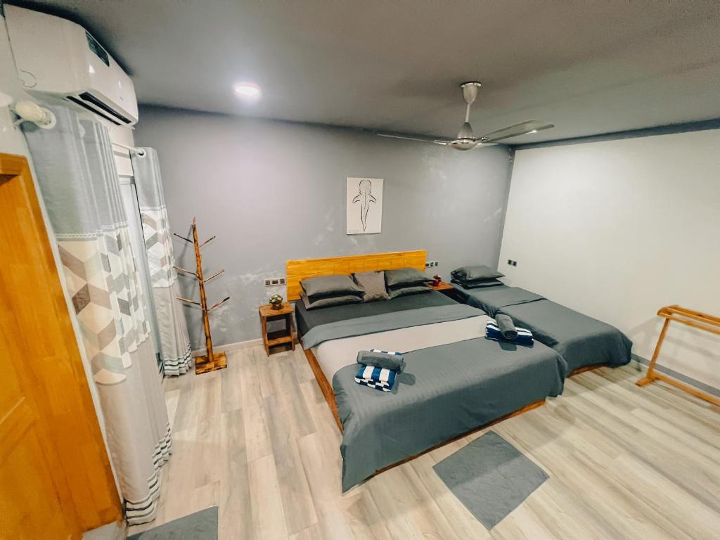 Postel nebo postele na pokoji v ubytování Mahchavaru Maldives