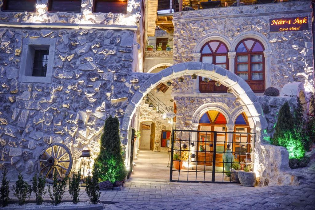 a building with an archway in front of a store at Aşk-ı Nare Cave Hotel in Nevsehir