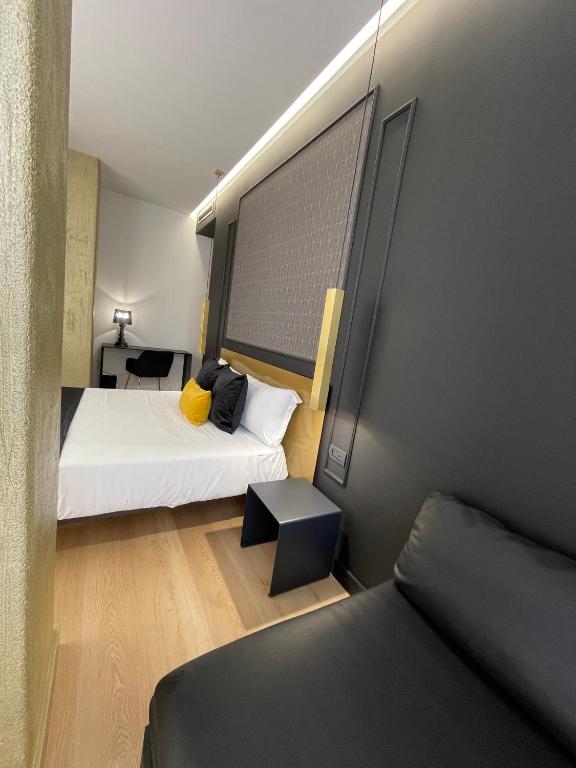 Łóżko lub łóżka w pokoju w obiekcie Plebiscito Boutique Rooms