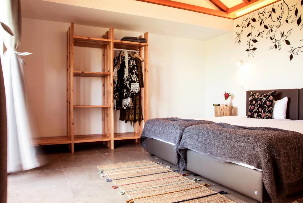 Postel nebo postele na pokoji v ubytování Pátio Ecolodge