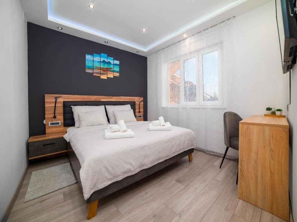Postel nebo postele na pokoji v ubytování Vega Lux Apartment