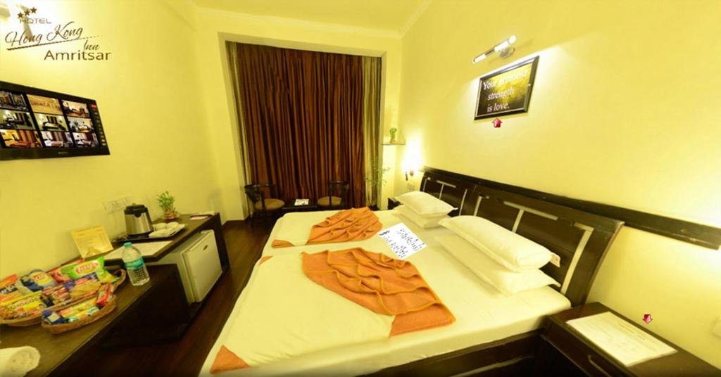Postel nebo postele na pokoji v ubytování Hotel Hong Kong Inn