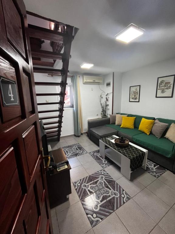 a living room with a couch and a table at Puerta Apartments in Kotor