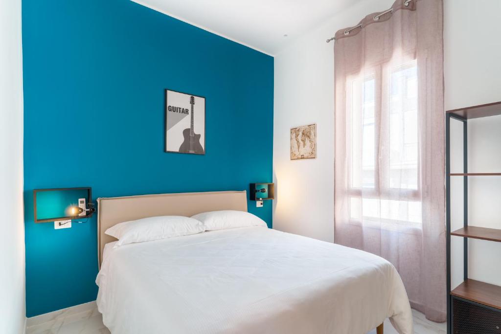A bed or beds in a room at GUENDALINA SWEET HOME - LA CASETTA Di GUENDALINA