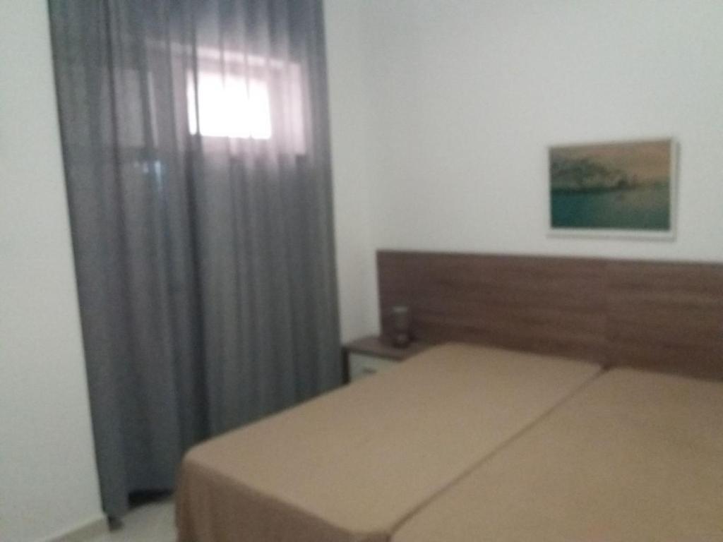 Кровать или кровати в номере Aquazul Beach Apartment
