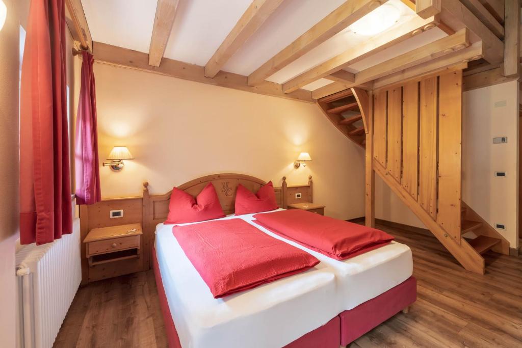 Postel nebo postele na pokoji v ubytování Albergo Conturina