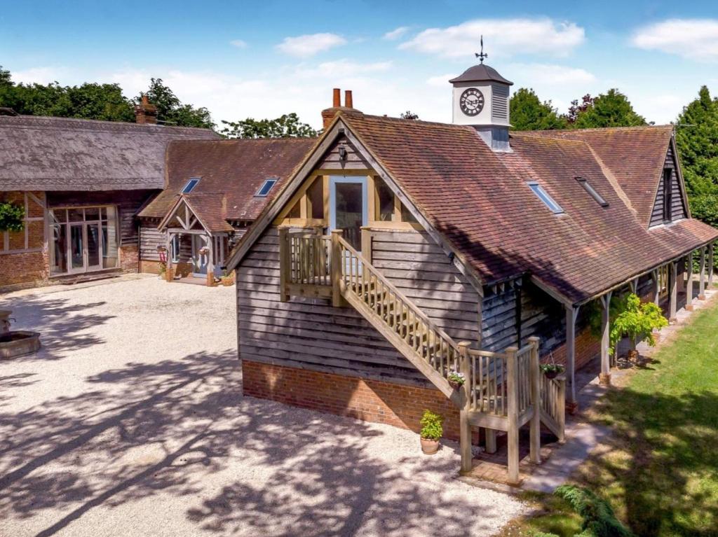 a building with a clock tower on top of it at Vineyard View - Hartley Wine Estate 