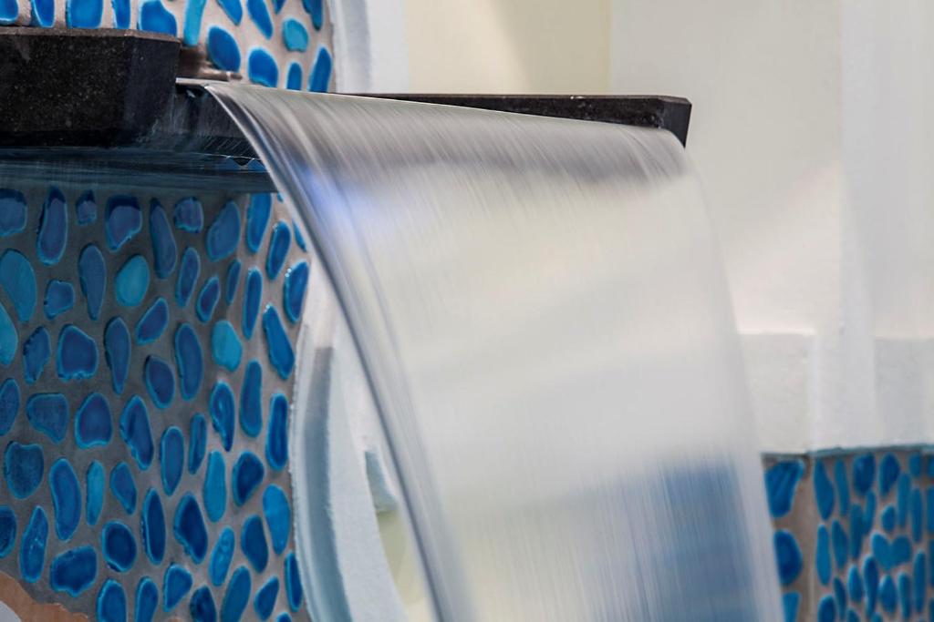 a piece of cloth being being used to paint a wall at Hotel Nettuno in Ischia