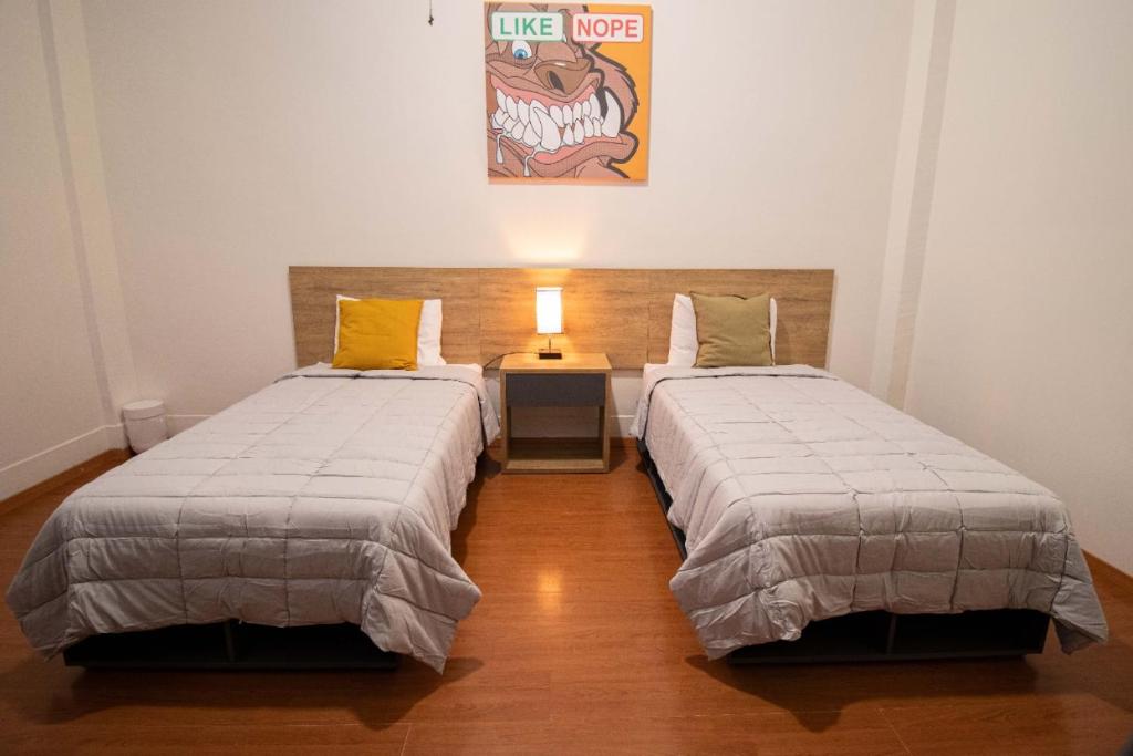 Postel nebo postele na pokoji v ubytování Hostal 170