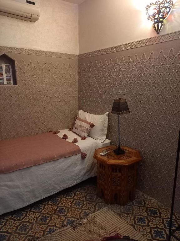 Postel nebo postele na pokoji v ubytování Riad Zayane Atlas
