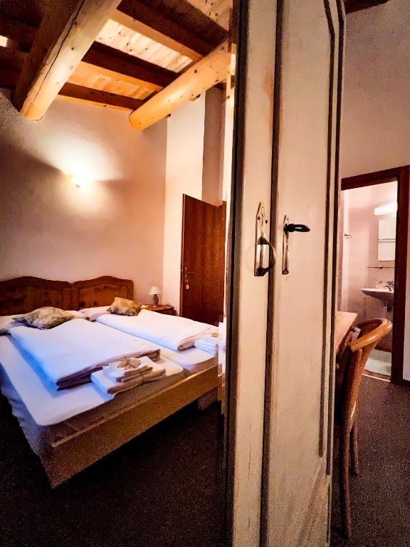 Postel nebo postele na pokoji v ubytování Albergo Ristorante Selva