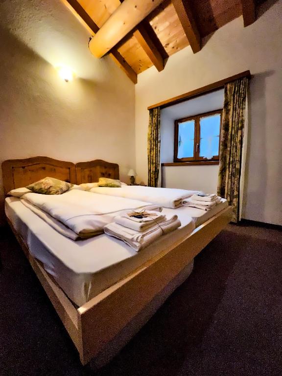 Postel nebo postele na pokoji v ubytování Albergo Ristorante Selva