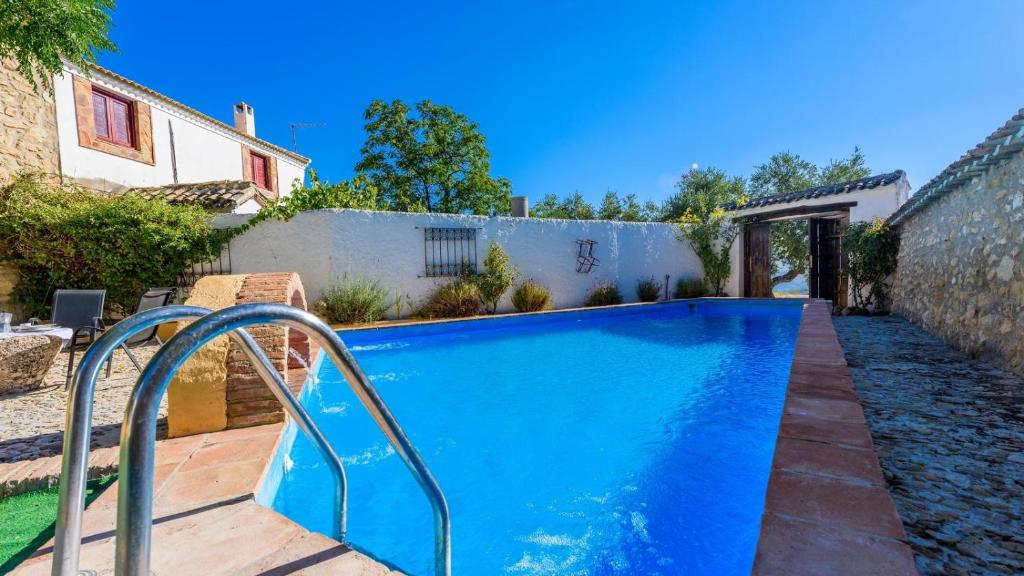 The swimming pool at or close to Casa Molino Algarinejo by Ruralidays