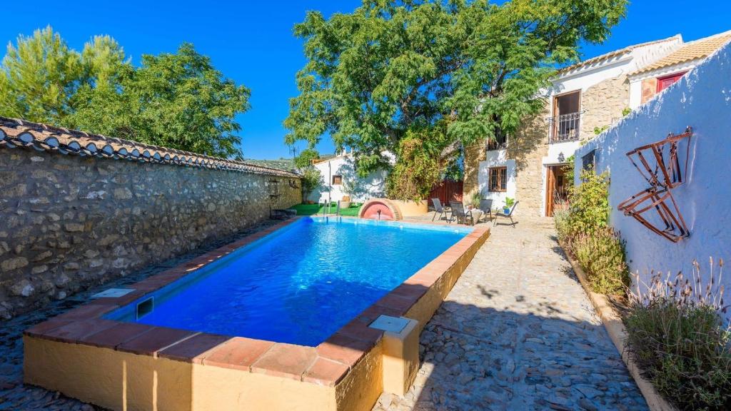 The swimming pool at or close to Casa Molino Algarinejo by Ruralidays