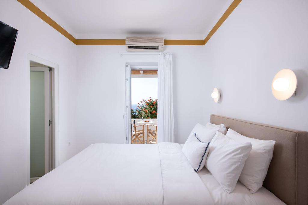 Posteľ alebo postele v izbe v ubytovaní Hotel Tagoo
