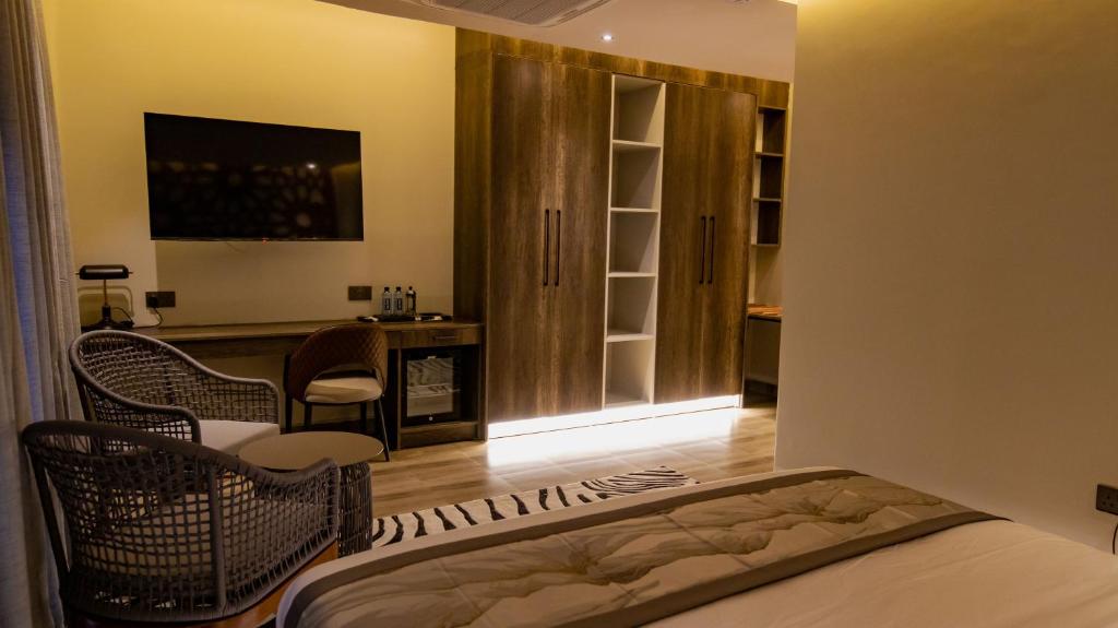 Postel nebo postele na pokoji v ubytování Gigiri Lion Villas II