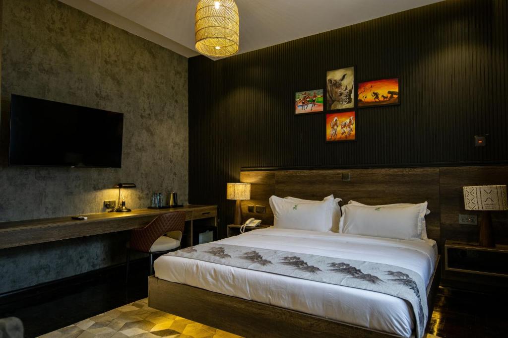 Postel nebo postele na pokoji v ubytování Gigiri Lion Villas II