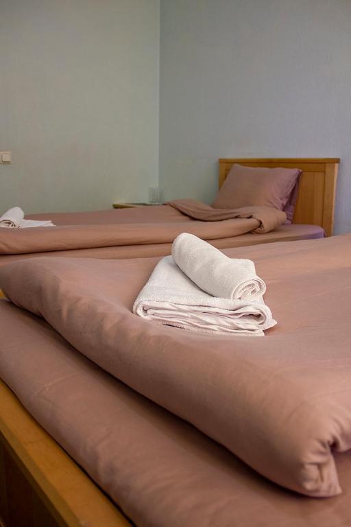 Postel nebo postele na pokoji v ubytování Olimpija Hotel & SPA