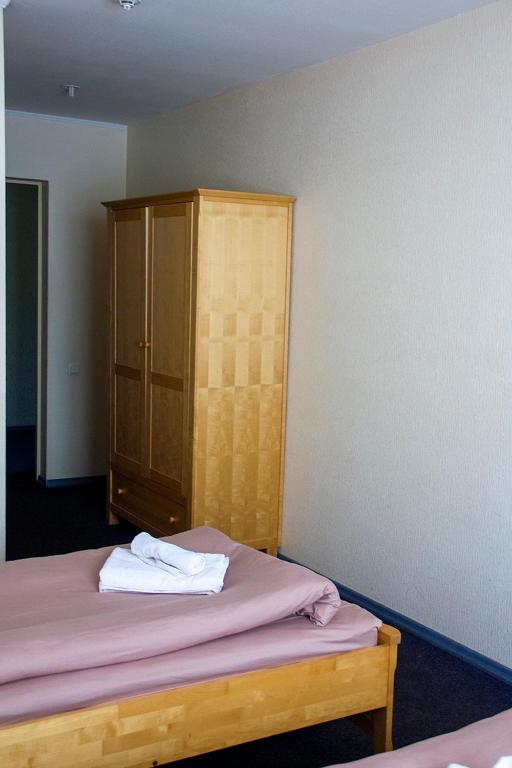Postel nebo postele na pokoji v ubytování Olimpija Hotel & SPA
