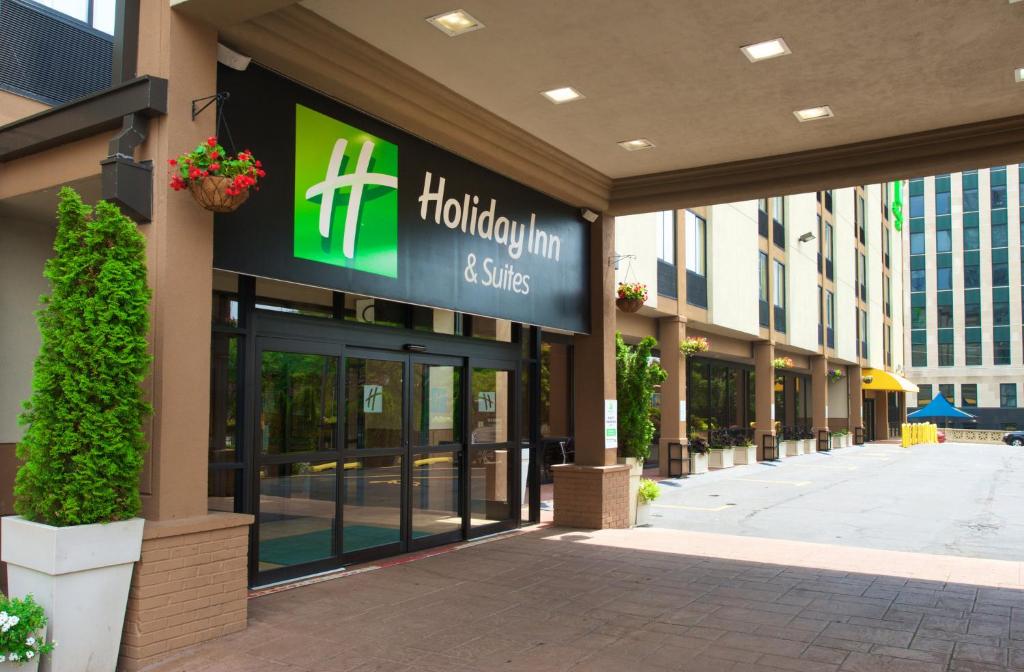 a building with a sign for a holiday inn and suites at Holiday Inn Hotel & Suites Chicago - Downtown, an IHG Hotel in Chicago