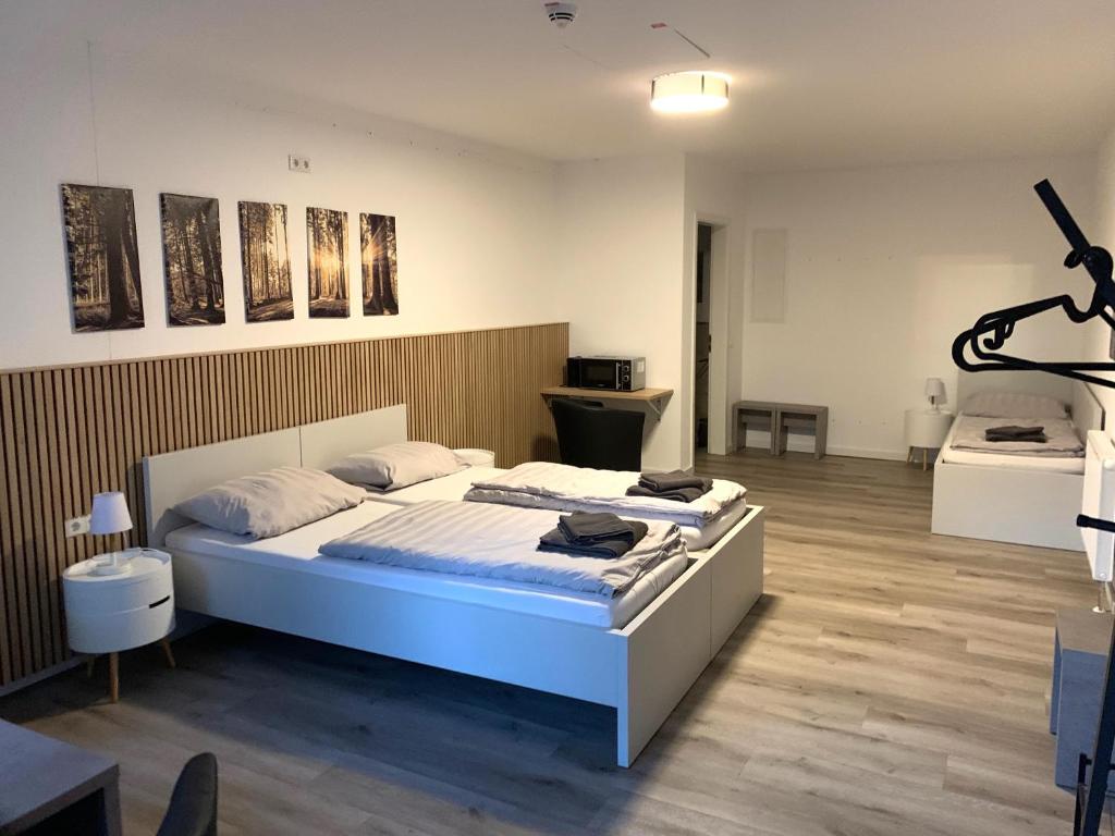 a bedroom with a large bed in a room at Luxus Apartment II - Netflix & Gym in Reken