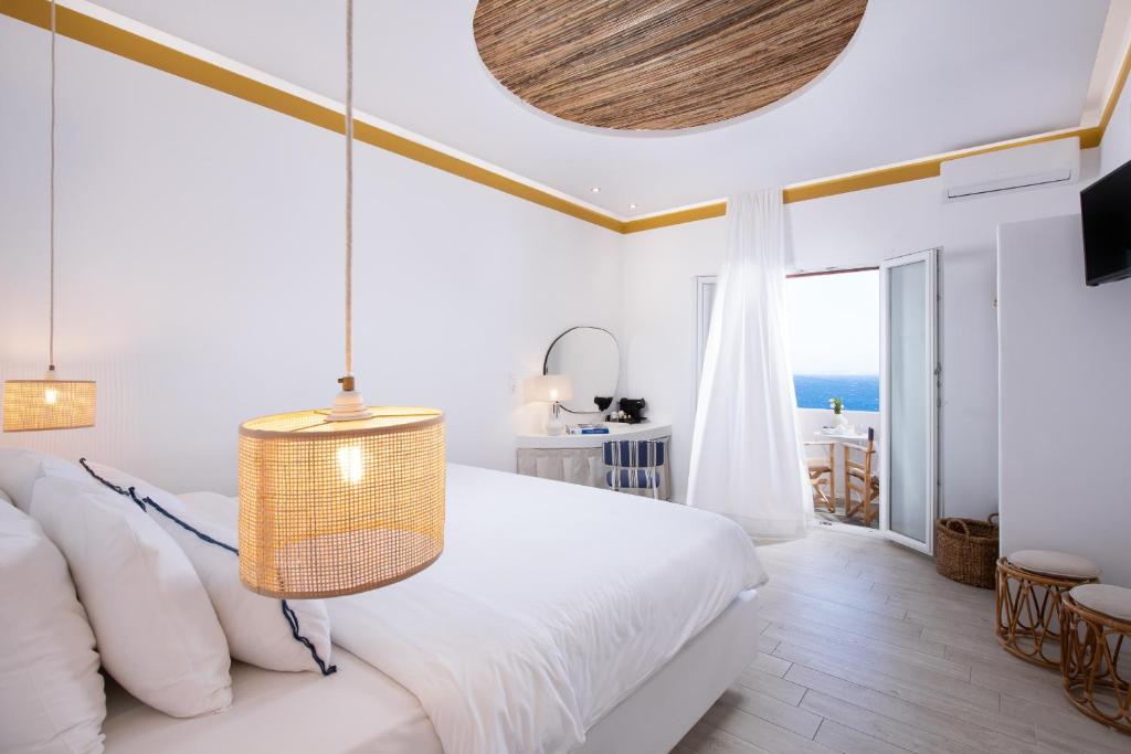 Posteľ alebo postele v izbe v ubytovaní Hotel Tagoo
