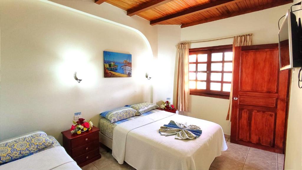 Postel nebo postele na pokoji v ubytování Hotel Cielo Azul