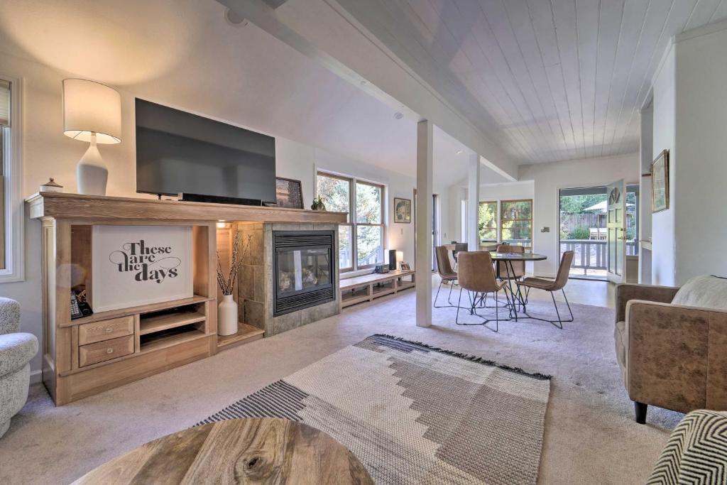 a living room with a fireplace and a tv at Nevada City Escape Near Dtwn and Pioneer Park! in Nevada City