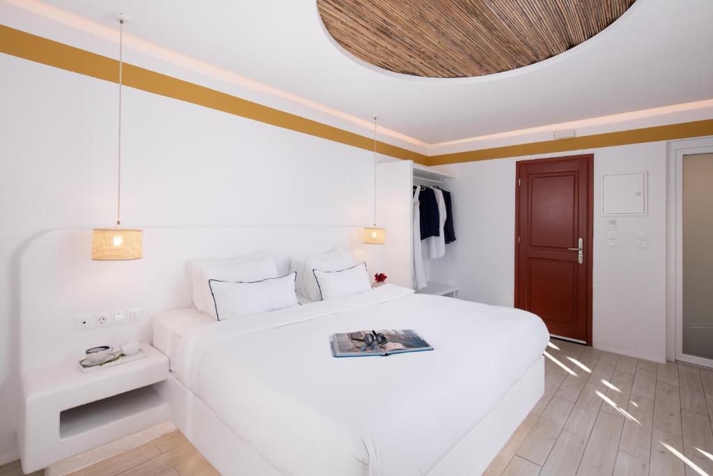Posteľ alebo postele v izbe v ubytovaní Hotel Tagoo