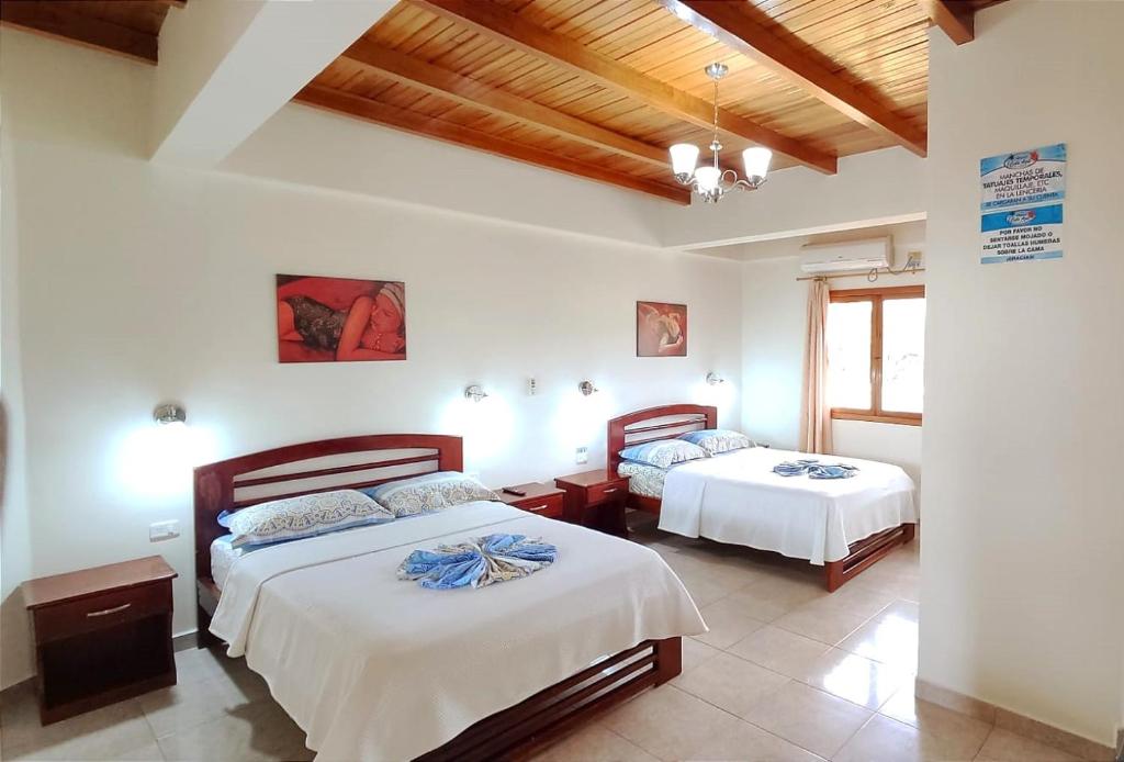 Postel nebo postele na pokoji v ubytování Hotel Cielo Azul